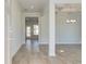 Bright foyer with wood-look flooring and a view into the dining area at 30 Begonia Ct, Covington, GA 30016