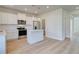 Modern kitchen with white cabinets, stainless steel appliances, and an island at 30 Begonia Ct, Covington, GA 30016