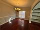 Elegant dining room with hardwood floors and chandelier at 129 Janney Cir, Mcdonough, GA 30253