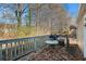 Small deck with grill and table, wooded backdrop at 1377 Ling Dr, Austell, GA 30168