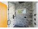 Modern bathroom with marble and tile shower, black fixtures, and a window at 2168 Millennium Ne Way, Atlanta, GA 30319