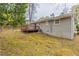 Backyard view of house with deck and grassy slope at 453 Utoy Sw Cir, Atlanta, GA 30331