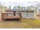 Back view of a house with a deck and grassy area at 453 Utoy Sw Cir, Atlanta, GA 30331