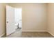 Empty bedroom with carpet flooring and open door to bathroom at 453 Utoy Sw Cir, Atlanta, GA 30331