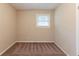Empty bedroom with carpet flooring and one window at 453 Utoy Sw Cir, Atlanta, GA 30331