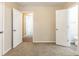 Empty bedroom with carpet flooring and open doors at 453 Utoy Sw Cir, Atlanta, GA 30331