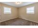 Empty bedroom with carpeted floors and two windows at 453 Utoy Sw Cir, Atlanta, GA 30331