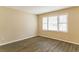 Spacious living room with large windows and wood-look flooring at 453 Utoy Sw Cir, Atlanta, GA 30331