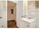 Simple bathroom with white tile and a new vanity at 2072 Whites Mill Rd, Decatur, GA 30032