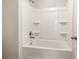 Simple bathroom with a shower/tub combo and shelving at 5290 Austrian Pine Ct, Cumming, GA 30040