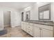 Elegant bathroom with double sinks, granite counters, and updated cabinets at 5290 Austrian Pine Ct, Cumming, GA 30040