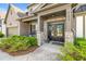 Inviting front entrance with double doors and stone accents at 5290 Austrian Pine Ct, Cumming, GA 30040