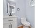 Updated bathroom with white vanity and marble countertop at 8914 Gardener Dr, Jonesboro, GA 30238