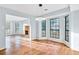 Sunlit dining room with hardwood floors and fireplace view at 8914 Gardener Dr, Jonesboro, GA 30238