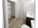 Bathroom with vanity, toilet, and laundry closet at 4727 Garden Hills Dr, Stone Mountain, GA 30083