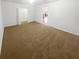 Large bedroom with neutral carpet and walk-in closet at 4727 Garden Hills Dr, Stone Mountain, GA 30083