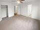 Large bedroom with carpet, closet, and access to bathroom at 4727 Garden Hills Dr, Stone Mountain, GA 30083