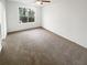 Spacious, unfurnished bedroom with neutral carpet and a large window at 4727 Garden Hills Dr, Stone Mountain, GA 30083