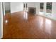 Living room with hardwood floors, fireplace, and French doors to the outside at 4727 Garden Hills Dr, Stone Mountain, GA 30083