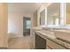 Modern bathroom featuring double vanity sinks, mirrors, and tiled floor at 1628 Fuma Leaf Way, Mcdonough, GA 30253