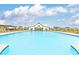Inviting community pool with crystal-clear water on a sunny day at 1628 Fuma Leaf Way, Mcdonough, GA 30253