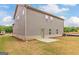 Backyard view of two-story home with siding and brick facade at 1628 Fuma Leaf Way, Mcdonough, GA 30253