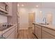 Modern kitchen with granite countertops, stainless steel appliances, and pantry at 1628 Fuma Leaf Way, Mcdonough, GA 30253