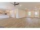Spacious living area with wood-look flooring, multiple windows, and open design at 1628 Fuma Leaf Way, Mcdonough, GA 30253