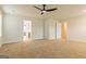 Large, carpeted main bedroom with ensuite bathroom and closet access at 1628 Fuma Leaf Way, Mcdonough, GA 30253