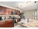 Well-equipped kitchen with stainless steel appliances, ample counter space, and wooden cabinets at 2137 Belmont Cir, Conyers, GA 30012