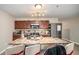 Modern kitchen featuring stainless steel appliances, wooden cabinetry, and an island at 2137 Belmont Cir, Conyers, GA 30012