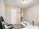 Home office with white desk, ergonomic chair, and neutral walls at 2137 Belmont Cir, Conyers, GA 30012