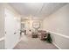 Upstairs hallway with plush carpeting, white doors, and chair and table at 2137 Belmont Cir, Conyers, GA 30012