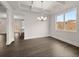 Dining area with coffered ceiling, modern chandelier, and window views at 3834 Kastler Dr, South Fulton, GA 30349