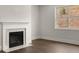 Cozy fireplace with marble surround in a bright living room at 3834 Kastler Dr, South Fulton, GA 30349