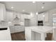 Open-concept kitchen featuring white cabinets, large island, stainless steel appliances, and ample counter space at 3834 Kastler Dr, South Fulton, GA 30349
