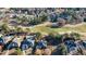 An aerial view of a golf course community with homes and lush landscaping at 3229 Carmichael Pl, Duluth, GA 30097