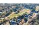 Aerial view of luxury homes near a golf course in a residential neighborhood at 3229 Carmichael Pl, Duluth, GA 30097