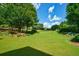 Lush green backyard overlooking a golf course at 3229 Carmichael Pl, Duluth, GA 30097
