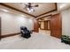 Open basement room with a massage chair, carpeted flooring, and a view to another room at 3229 Carmichael Pl, Duluth, GA 30097