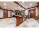 Open concept basement with kitchen, bar, and living area at 3229 Carmichael Pl, Duluth, GA 30097