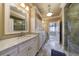 Elegant bathroom with white cabinets, granite countertops, and a glass shower at 3229 Carmichael Pl, Duluth, GA 30097