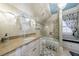 Elegant bathroom with white vanity, tiled shower, and decorative window at 3229 Carmichael Pl, Duluth, GA 30097