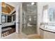 Modern bathroom with glass shower, soaking tub, and tile flooring at 3229 Carmichael Pl, Duluth, GA 30097
