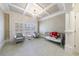 A bedroom or Bedroom with two armchairs, a crib, and plantation shutters at 3229 Carmichael Pl, Duluth, GA 30097