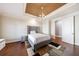 Bedroom featuring hardwood floors, a plush bed, and a walk-in closet at 3229 Carmichael Pl, Duluth, GA 30097