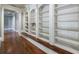Built-in bookshelves in hallway with hardwood floors at 3229 Carmichael Pl, Duluth, GA 30097