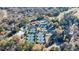 An aerial perspective showcasing the community's tennis courts and clubhouse at 3229 Carmichael Pl, Duluth, GA 30097