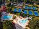 An aerial view of the community pool, waterslide, tennis courts, and clubhouse at 3229 Carmichael Pl, Duluth, GA 30097