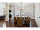 Dining area with round table, leather chairs, and large windows with plantation shutters at 3229 Carmichael Pl, Duluth, GA 30097